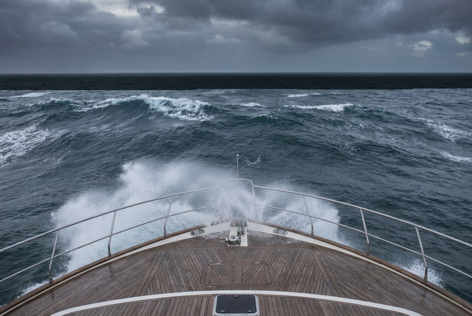 Open ocean at dusk from the deck of a motor yacht